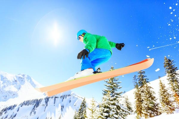 a man skiing down a snowy mountain